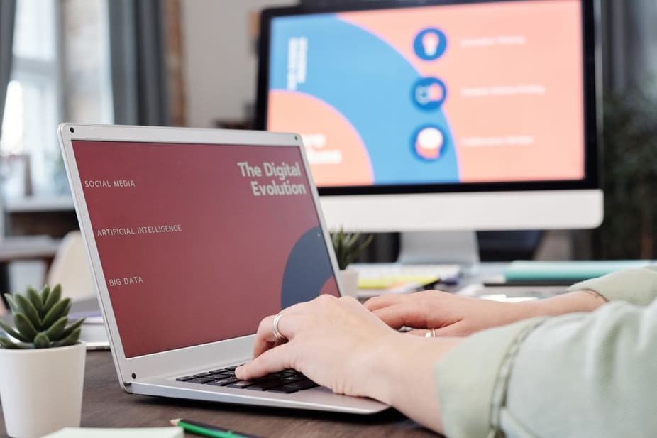 SEO specialist reviewing website analytics on a laptop in a Birmingham office